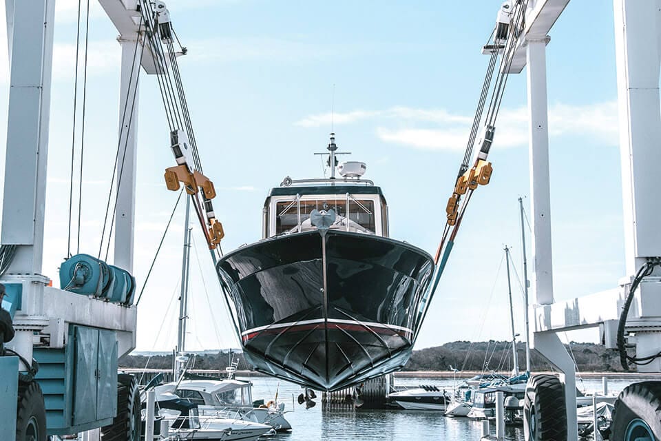 Boat in crane at Lake Yard Boat Yard