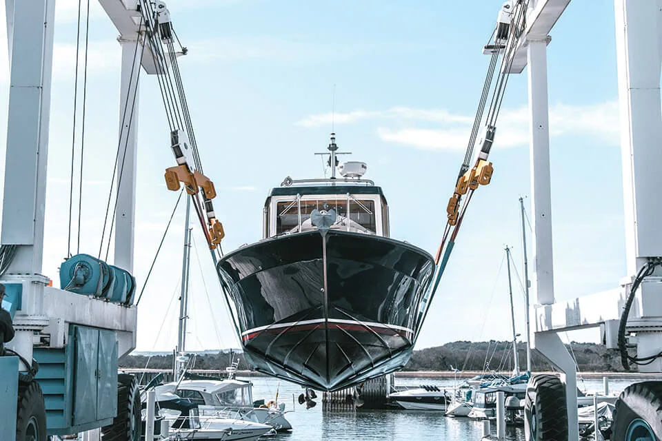 Boat in crane at Lake Yard Boat Yard